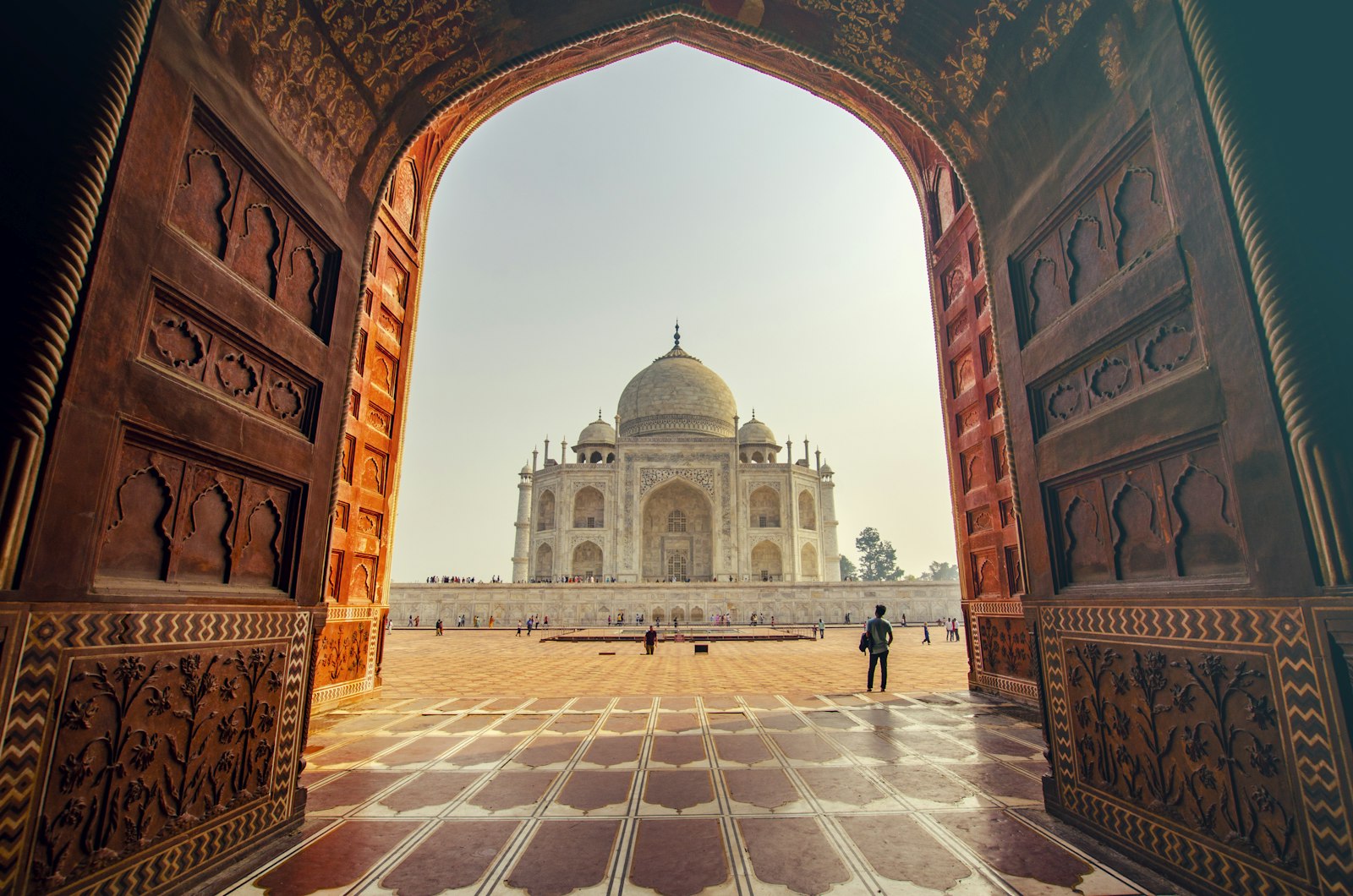 Taj Mahal framed by the red sandstone gateway arch